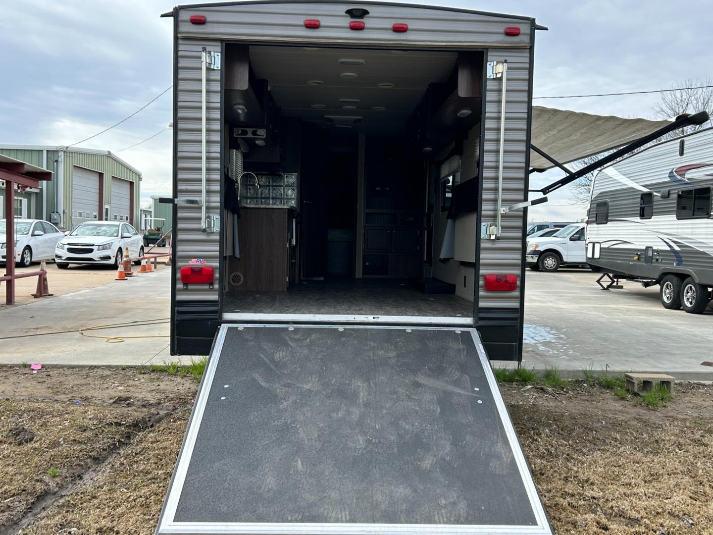 2017 BROWN /TAN HEARTLAND TRAIL RUNNER TOY HAULER (5SFEB3025HE) , located at 17760 Hwy 62, Morris, OK, 74445, 35.609104, -95.877060 - Get ready to take your family camping and spend some time outdoors playing with your off-road toys. Take this 2017 Heartland Trail Runner 26TH toy hauler travel trailer to the outdoor playground of your choice! As you walk into this camper you will notice the kitchen, it has a 3 burner stove, micro - Photo#3